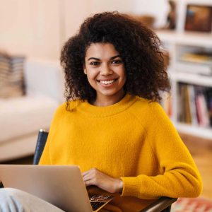 image-of-african-american-woman-using-laptop-while-LEQZJET.jpg